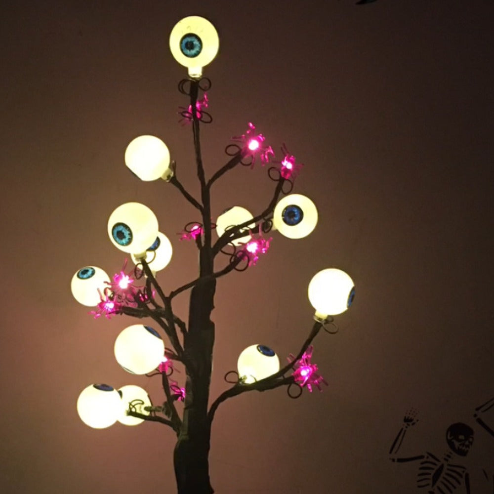 Leuchtende Krone der Schaurigen Augenbaum-Lampe mit Augäpfeln und Spinnen aus der Nähe
