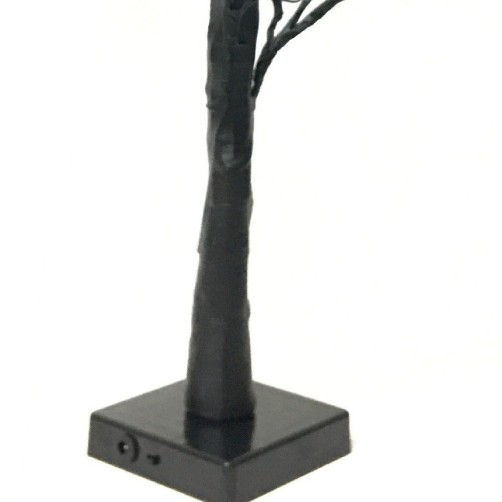 Sockel der Schaurigen Augenbaum-Lampe mit schwarzem Stamm und dezentem Anschluss am Fuß